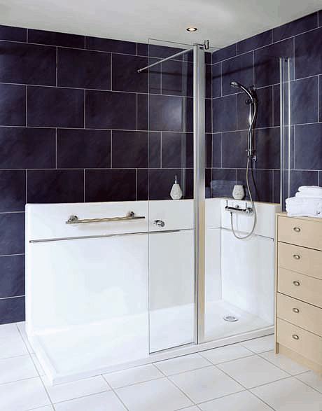 Fixed semi-frameless glass shower screen panel with a slim hinged panel that can be angled inward to retain spray