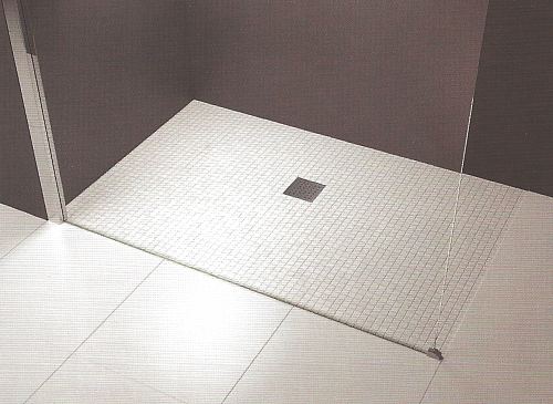 Prefabricated wet room shower floor former with a square drain.