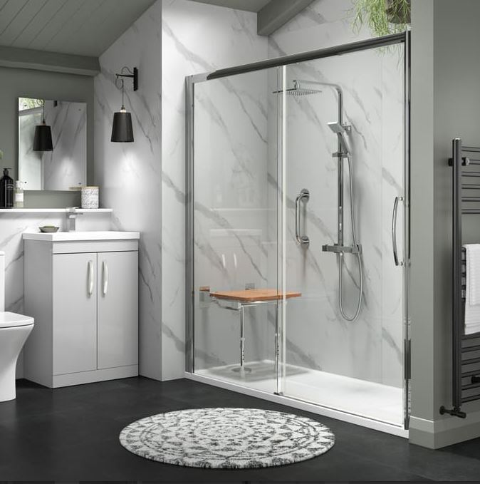 An alcove converted to a shower enclosure using a large shower tray and sliding door screen.